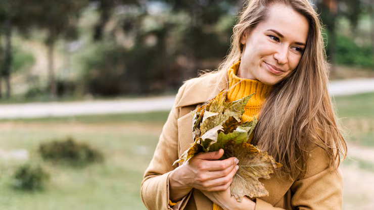woman-holding-bunch-leaves_23-2148619440